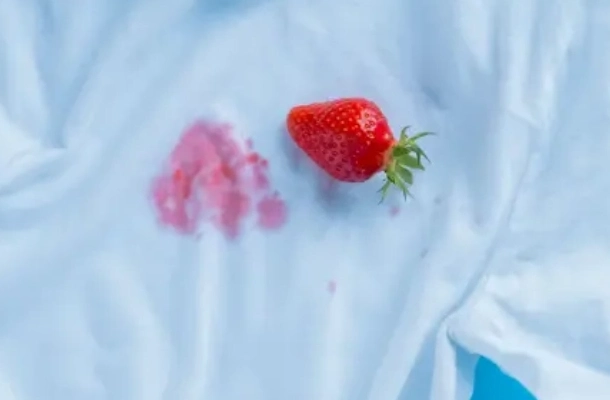 Strawberry stain on white t shirt.